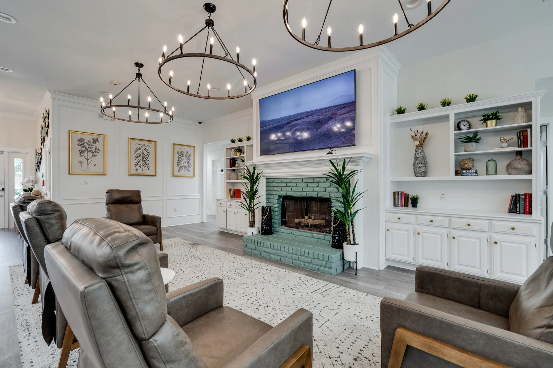 Living room at Willow Creek with lounge chairs and a chandelier